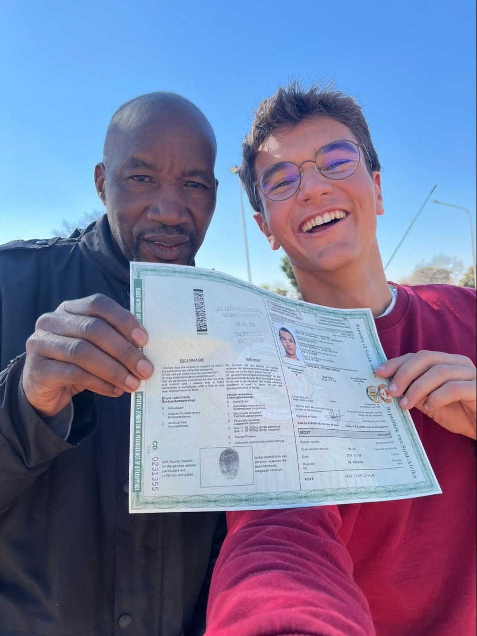 Eduard with his instructor after passing his driving test